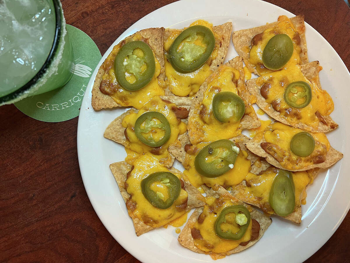 Old School Nachos are just chips, beans, cheese and jalapeños at Carriqui at the Pearl in San Antonio. The bar menu includes the Carriqui Margarita. 
