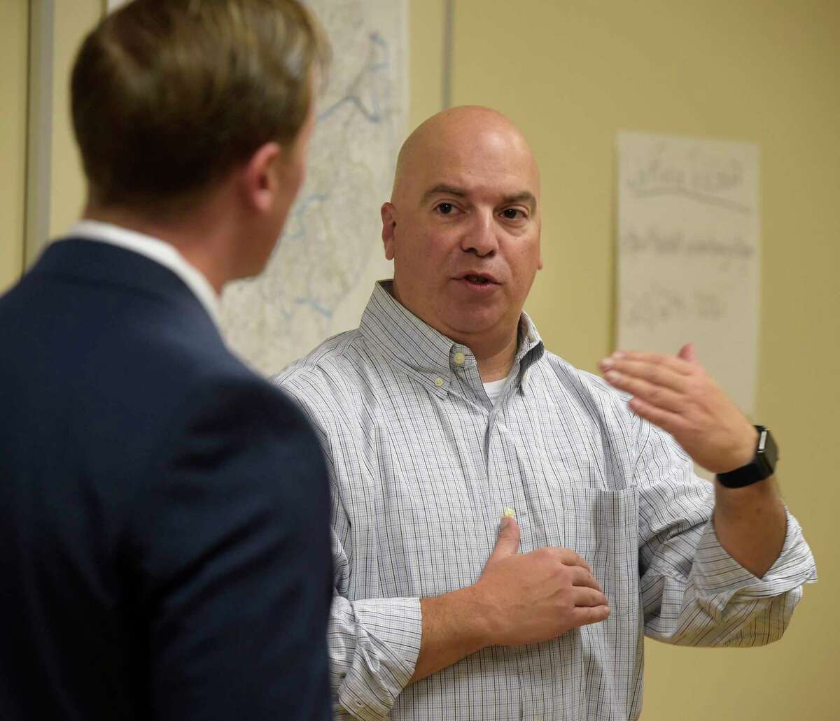 Lt Andrew Corrado, Professional Standards Division, talks with Clint Collins, Axon VR Subject Matter Specialist, during a presumption    of Axon’s VR, virtual reality, grooming  to the Danbury Police Department connected  Thursday morning. It included taser simulator technology. November 17, 2022, Danbury, Conn.