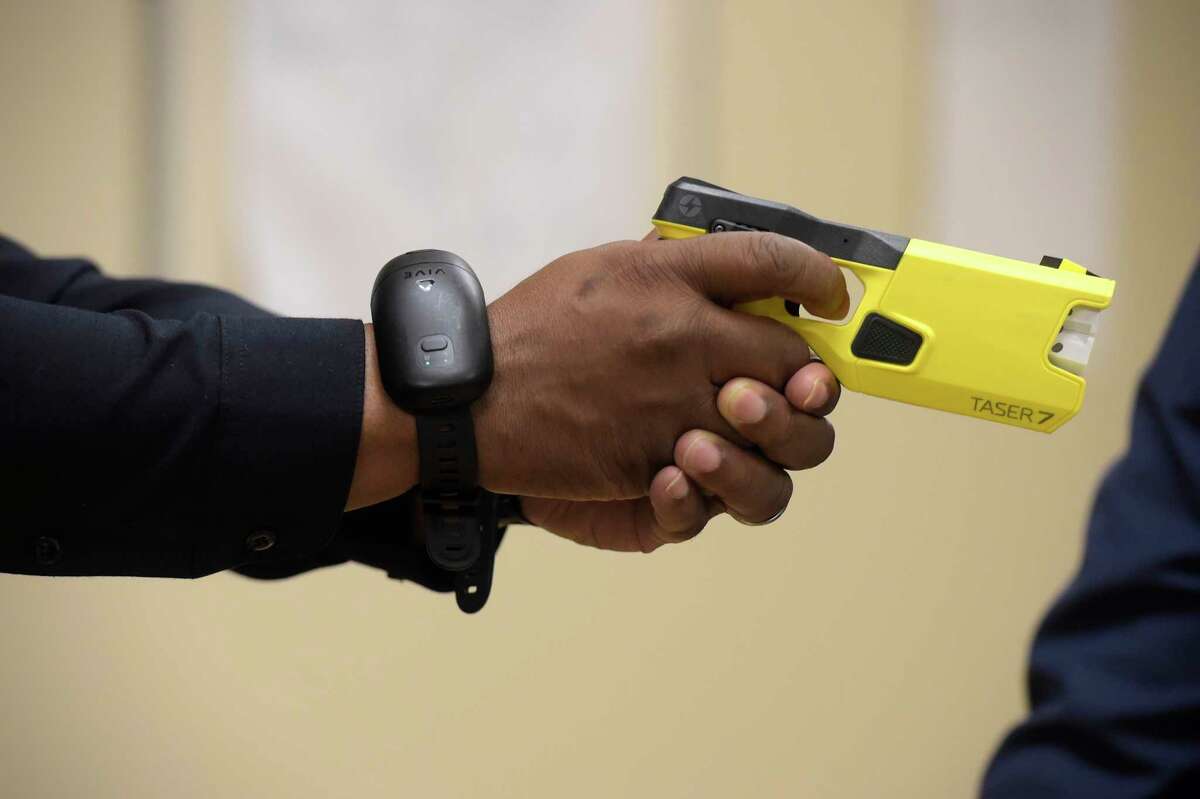 Chief Patrick Ridenhour uses a specially equipped taser during a presumption    of Axon’s VR, virtual reality, grooming  to the Danbury Police Department connected  Thursday morning. It included taser simulator technology. November 17, 2022, Danbury, Conn.