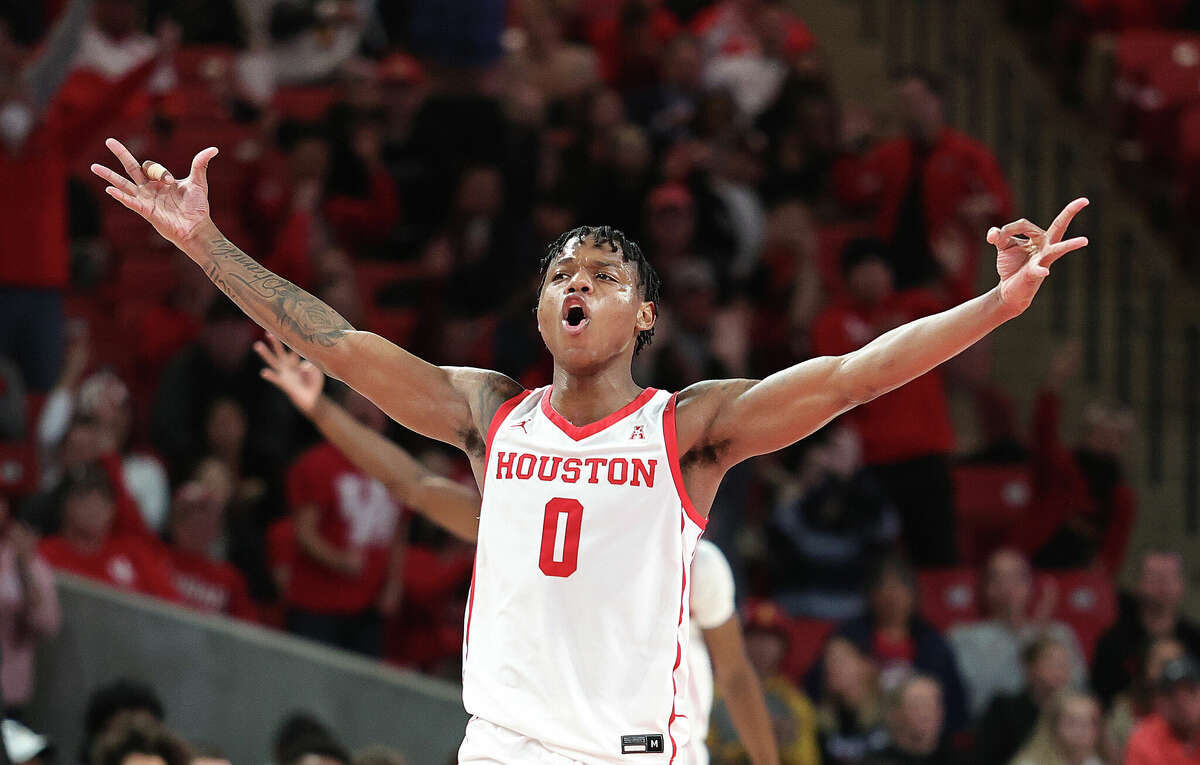 Marcus Sasser #0 of the Houston Cougars reacts after three point basket against the Oral Roberts Golden Eagles at Fertitta Center on November 14, 2022 in Houston, Texas.