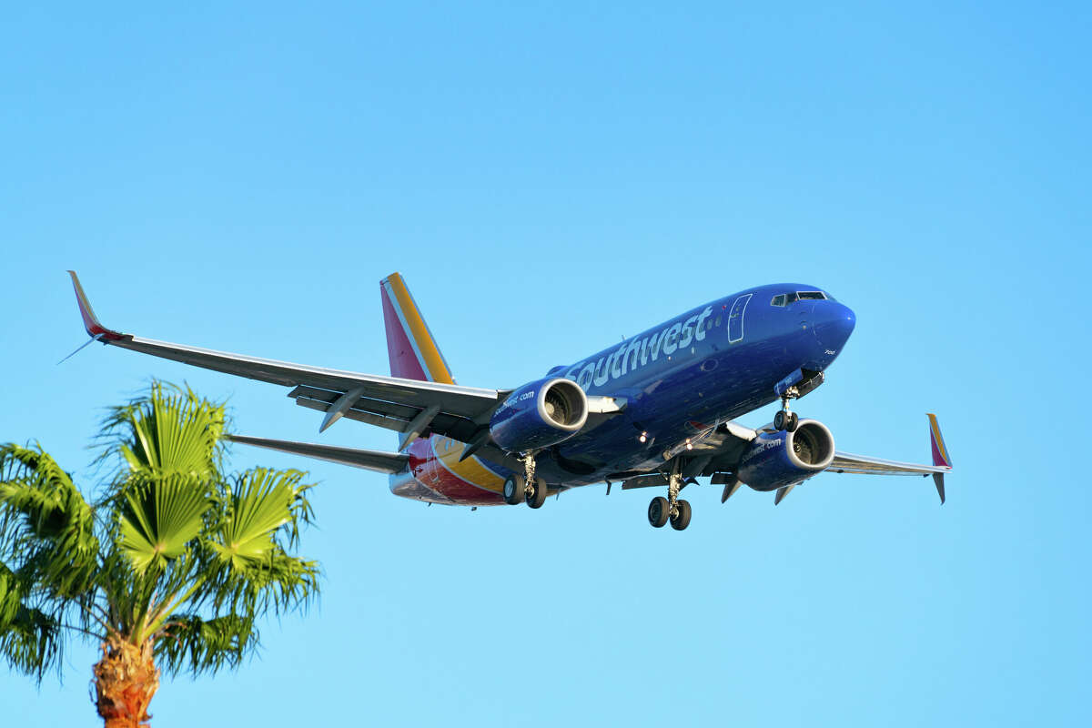 A Southwest Airlines Boeing 737-7H4 arrives at Los Angeles International Airport in October. Southwest is adjusting its California services in January, introducing daily flights from Long Beach Airport to Salt Lake City and ending service from Orange County's John Wayne Airport to Chicago Midway and Salt Lake City.