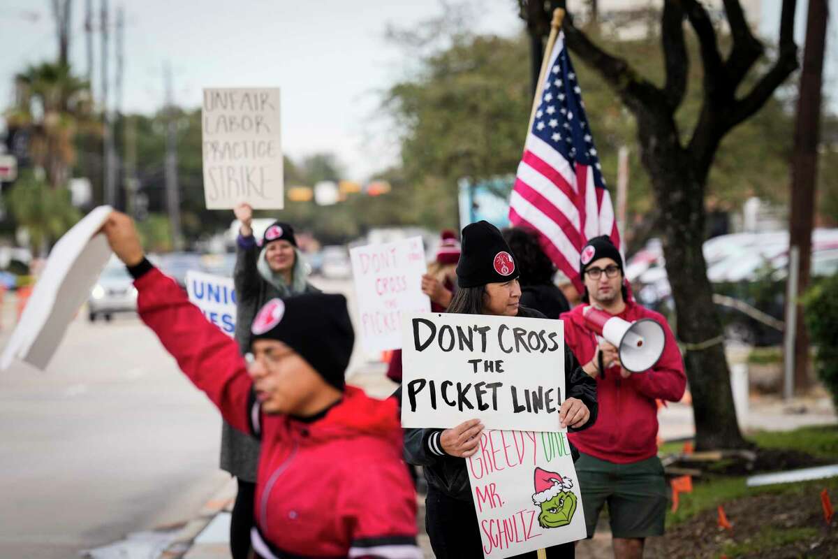 People protest unfair labor practices outside the Starbucks location in the 1200 block of Shepherd on Thursday, Nov. 17, 2022 in Houston. Starbucks workers are on strike for Red Cup Day, the day where anyone gets a free red cup.