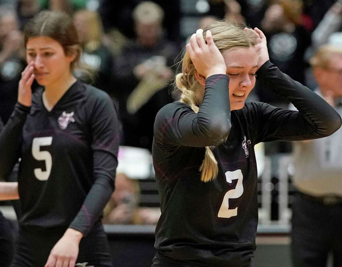 East Bernard High School’s Bailey Leopold (5) and Abby Hudgins (2) react to losing the match against Bushland High School in a state semifinal volleyball match, won by Bushland, on Thursday, November 17, 2022 at the Curtis Culwell Center in Garland, Texas. CREDIT: Louis DeLuca for The Houston Chronicle