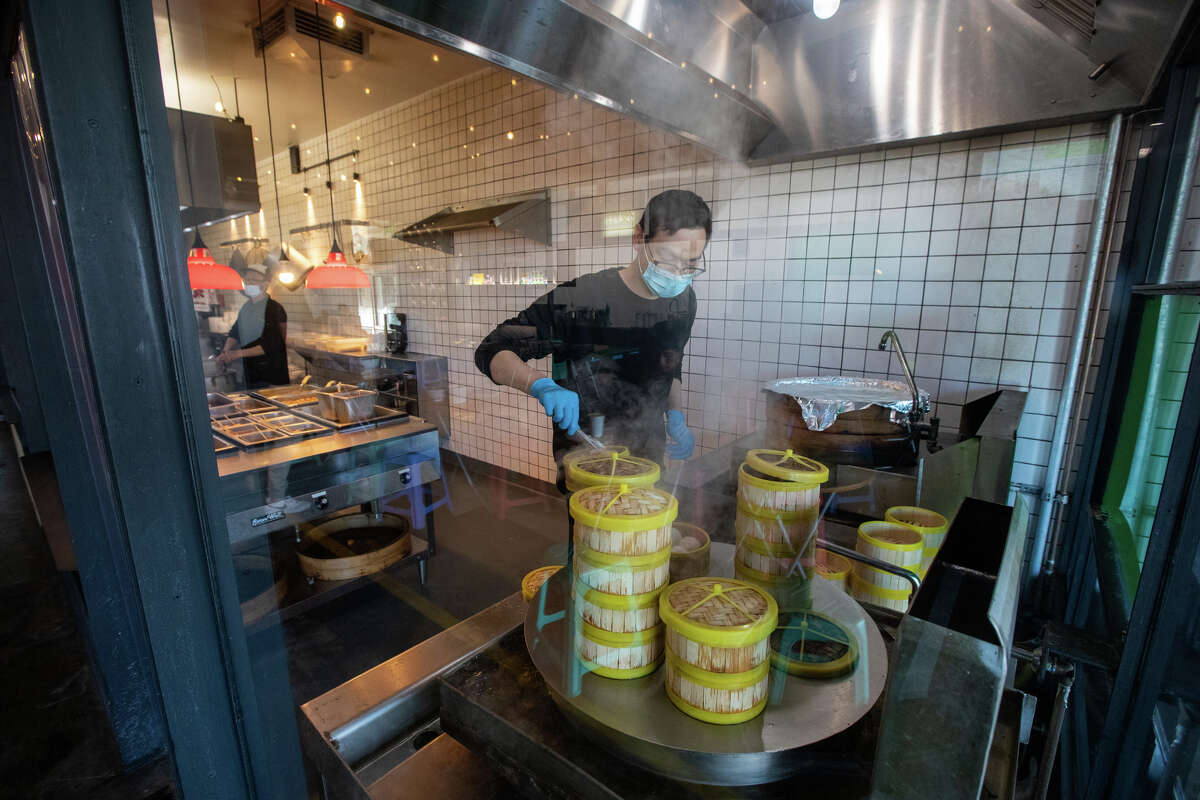 A worker check out the steamed dumplings at The Night Market in South San Francisco, California on November 10, 2022.