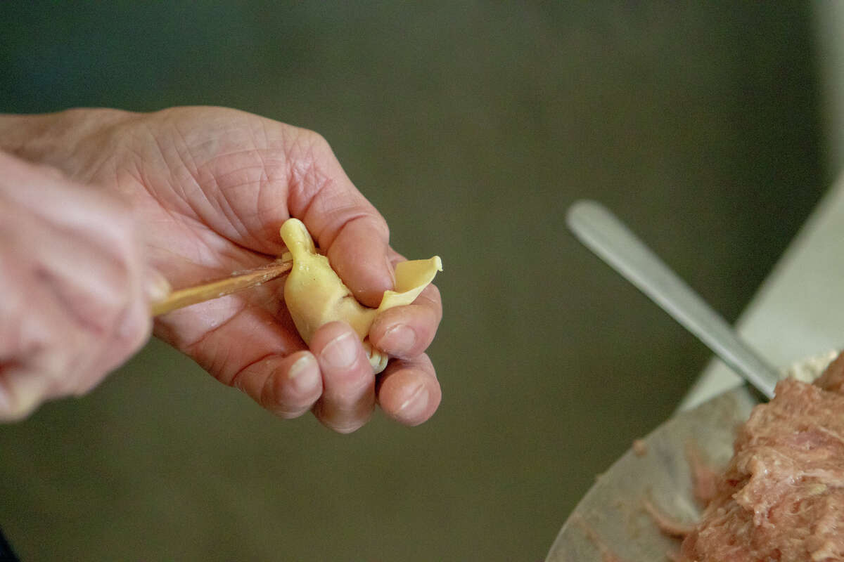 Chef Fung makes some fresh pork and shrimp wontons at The Night Market in South San Francisco, California on November 10, 2022.