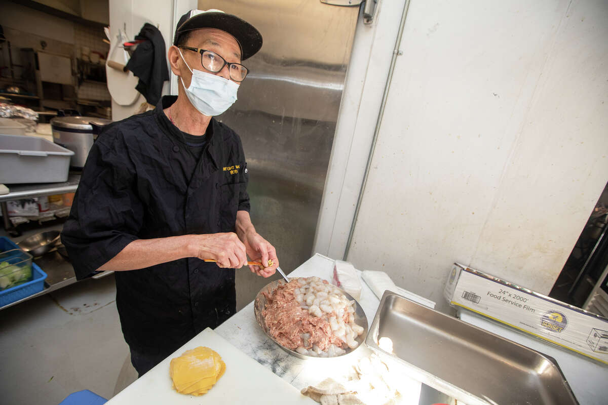 Chef Fung makes some fresh pork and shrimp wontons at The Night Market in South San Francisco, California on November 10, 2022.