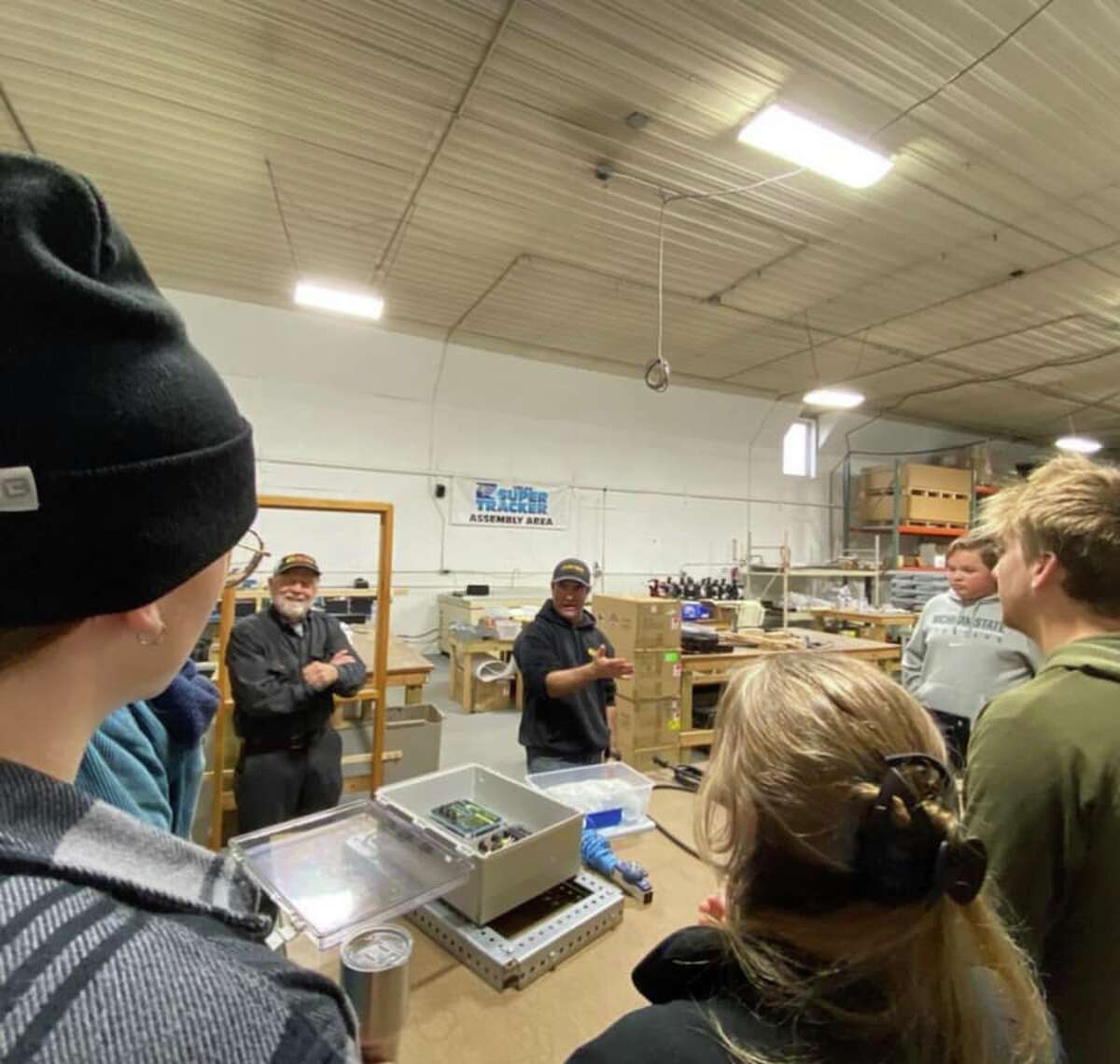 Students from the Interact Club and sustained ecology class at Frankfort High School learn more about solar energy at CBS Solar in Copemish. 