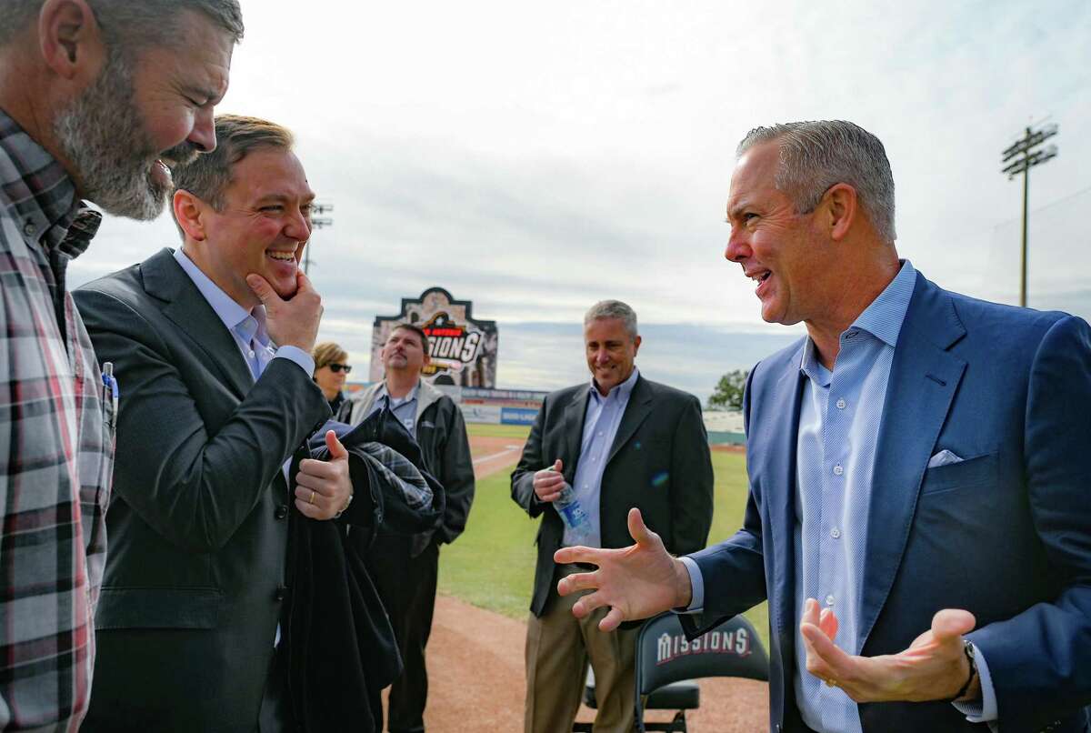 Will Wood, left, and Peter Holt chat with Reid Ryan, right, CEO of Ryan Sanders Baseball at a press conference to announce the new ownership of the San Antonio Missions.