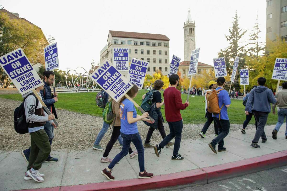 Student researchers and instructors picket at UC Berkeley on Wednesday as part of a strike by workers across the UC system.