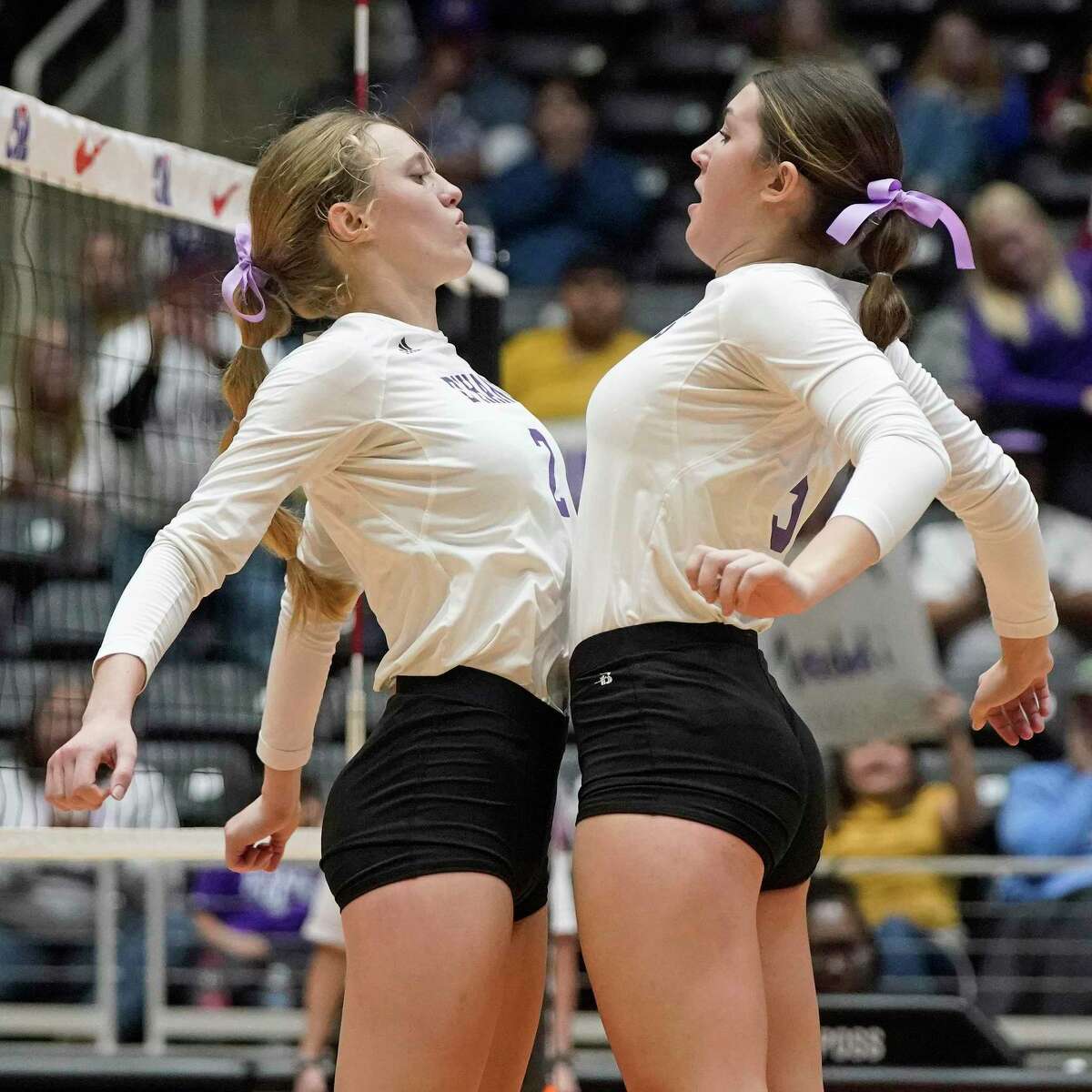 D’Hanis High School’s Mabry Herrmann, left, and Kylee Thompson celebrate a point against Blum High School in their state final volleyball match on Wednesday, November 17, 2022 at the Curtis Culwell Center in Garland, Texas. CREDIT: Louis DeLuca for the San Antonio Express News