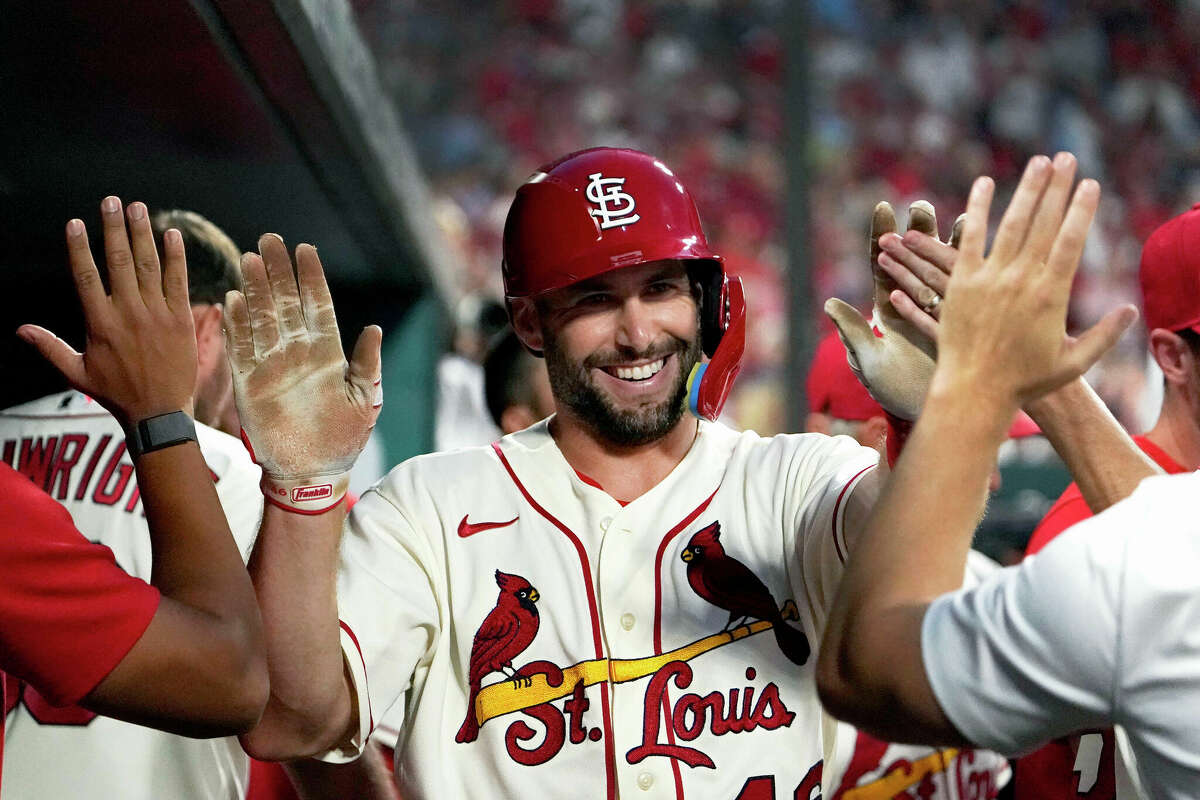 The Cardinals' Paul Goldschmidt on Thursday was named the winner of the 2022 National League Most Valuable Player Award. He is shown being is congratulated by teammates after scoring against the Milwaukee Brewers in August. Teammate Nolan Arenado finished third in the voting.