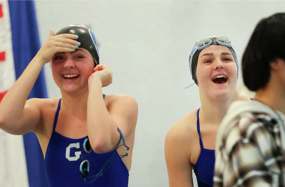 Glastonbury's Avery and Riley Kudlac are all smiles while at the pool with the Guardians' swimming and diving team.
