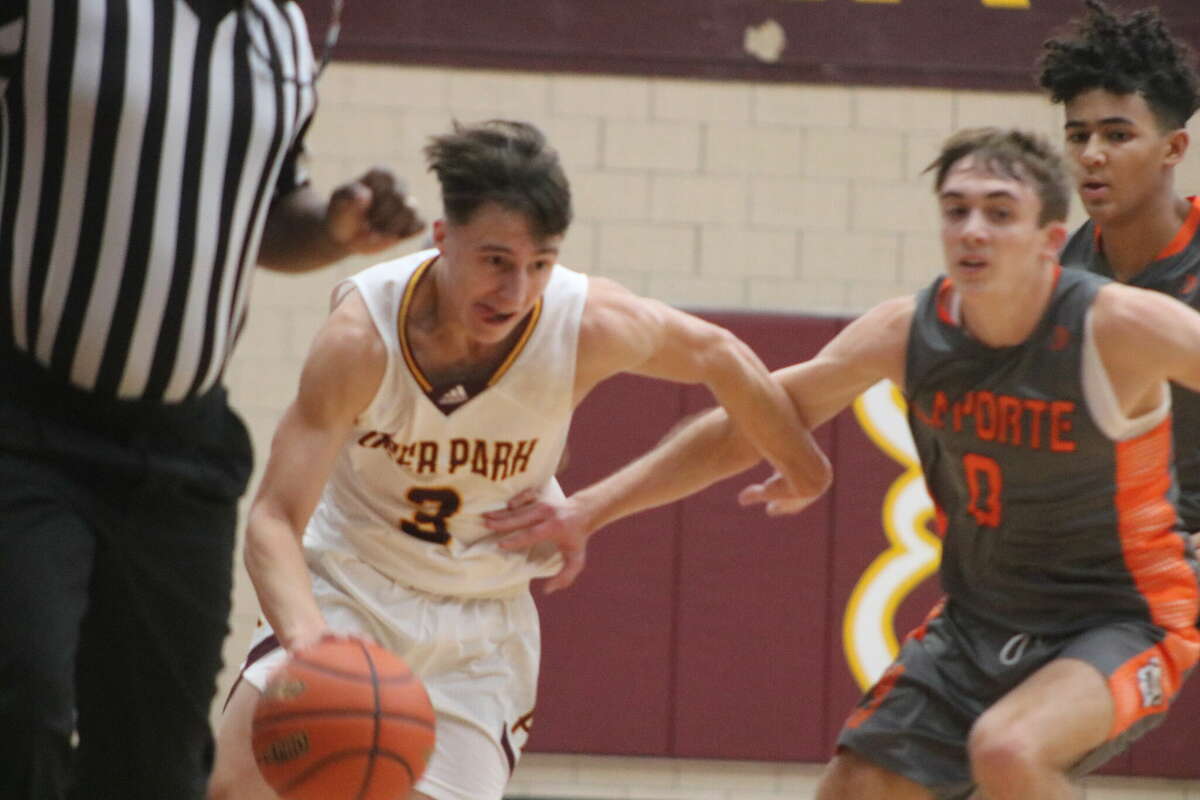 Deer Park's Evan Goodson (3) tries to get past the defense of Brady Axtell during their Thursday afternoon Texas Invitational game at Watkins Gym.