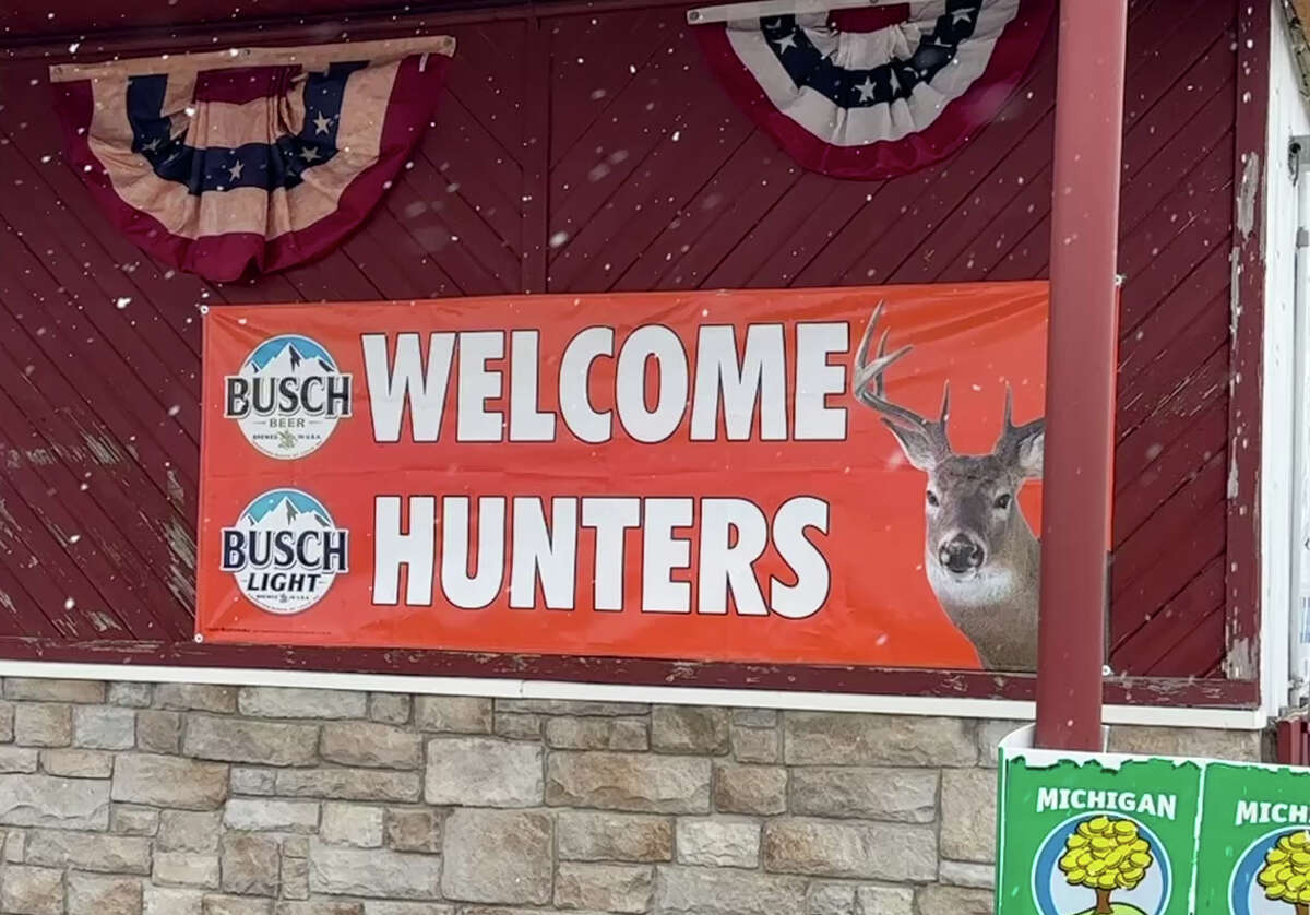 Tribune writers Mark Birdsall and Tom Greene loosened their belts and reunited with the hunter's buffet at Biff's Bar and Grill in Kinde on the opening day of gun season. Above, a sign welcomes hunters to Biff's in Kinde on Tuesday.