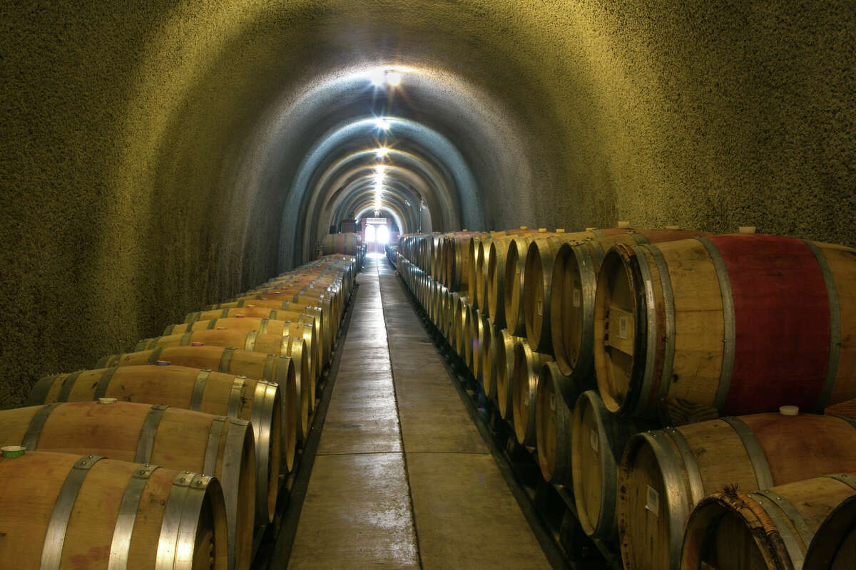 Oak barrels of aging wine are stored in the caves at Gundlach Bundschu Winery in Sonoma, California.