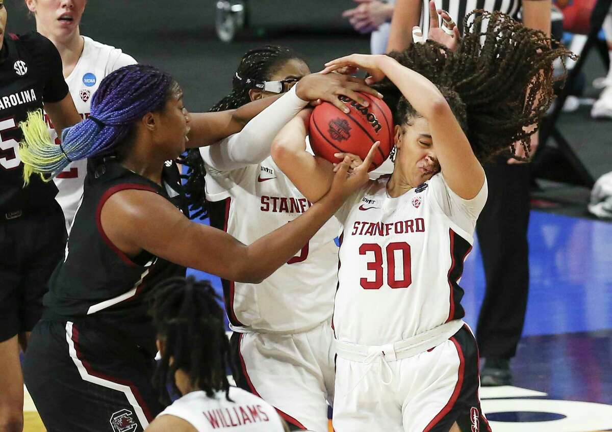 Stanford University's Hayley Jones, 30, and University of South Carolina's Aaliyah Boston, 04, tangled over a rebound during the 2021 NCAA Women's Finals for Nationals Semifinal Basketball game at the Alamodome on Friday, April 2, 2021. Fit.