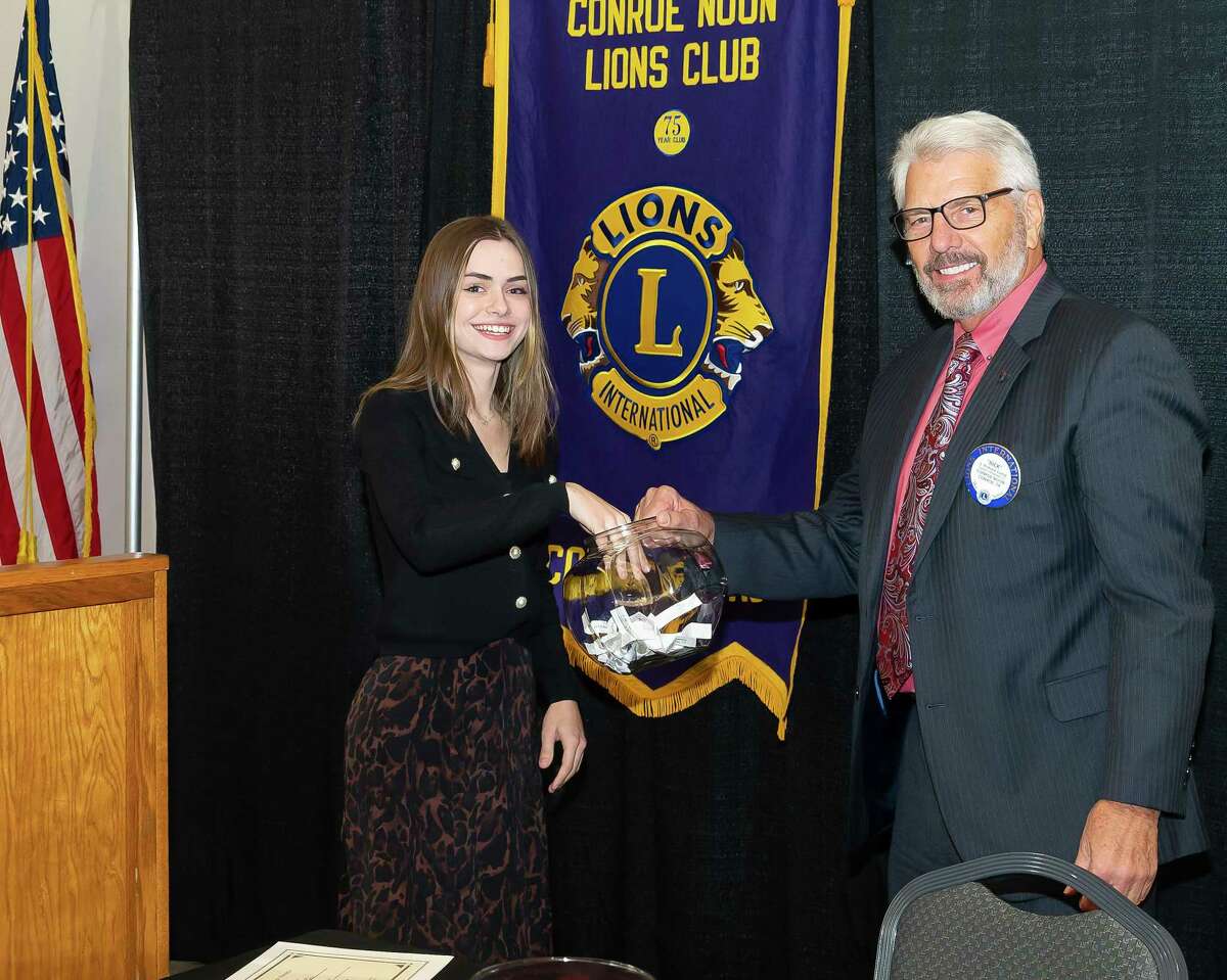 CHS senior Sky Castner (left) pulls a question from Lion Rick Camp (r) at the Conroe Noon Lions Club annual Outstanding Youth Contest last week. As the winner Sky received $2,000 in scholarship funds based on her leadership, community service, GPA, interview and a Q&A during the contest.