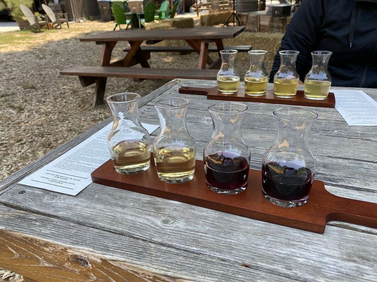 Guest enjoy cider and wine flights outside at Horse & Plow. 