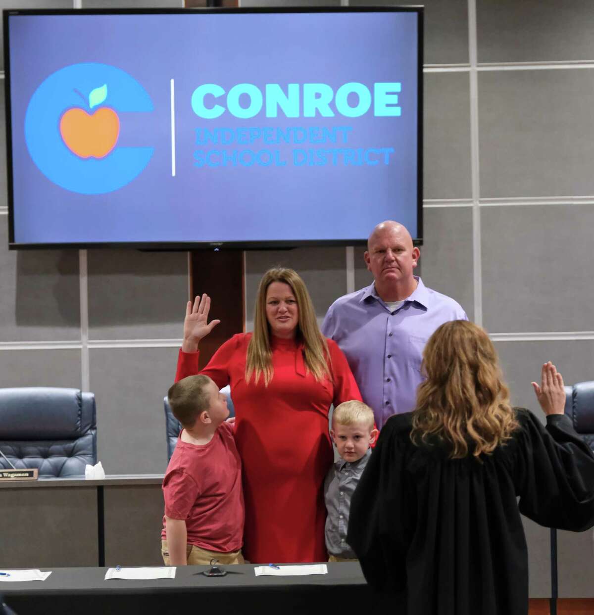 2022. Melissa Dungan (C) is sworn in as a Conroe I.S.D Trustee, while her family stands with her on Friday, Nov. 18, 2022, in Conroe.