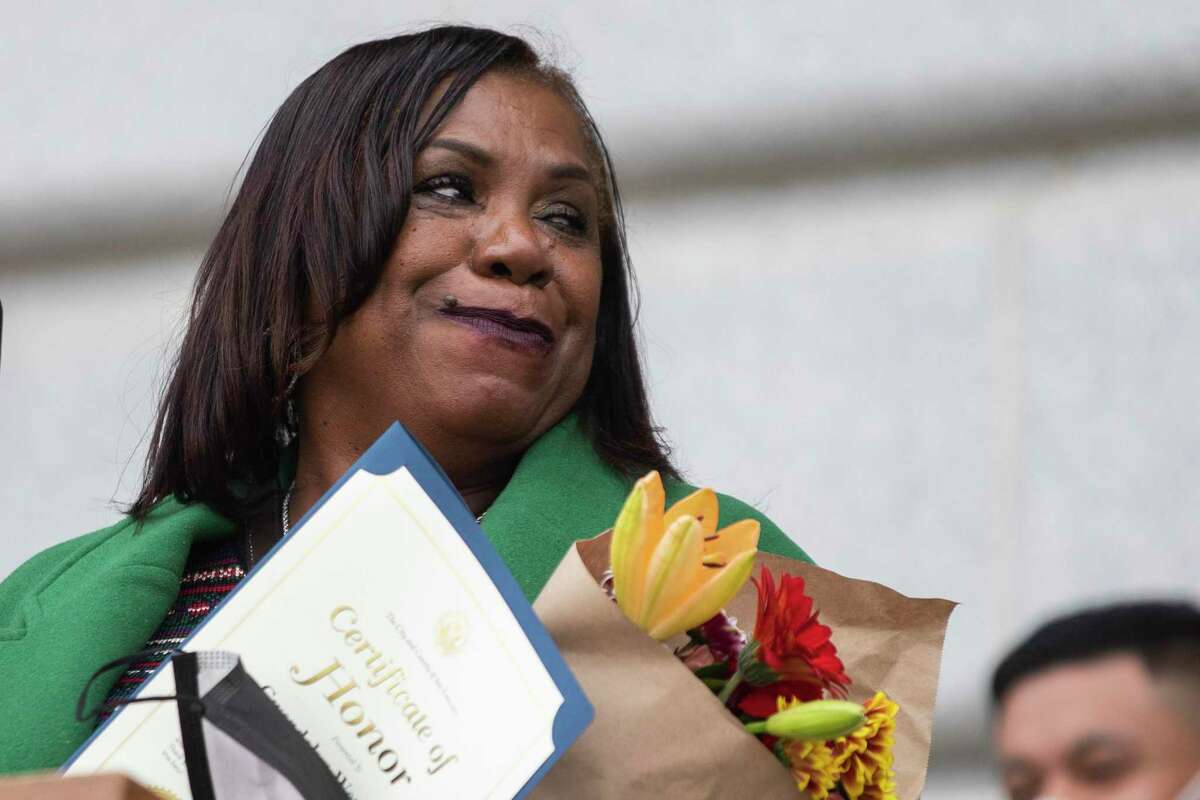Gwendolyn Westbrook of The United Council of Human Services holds flowers as she speaks after being presented with an award by San Francisco Mayor London Breed honoring her service while on the steps of City Hall in San Francisco, Calif. Monday, November 15, 2021.