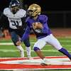 CBA quarterback Donald Jones picks up yardage during the Class AA state quarterfinals against Pittsford on Friday, Nov. 18, 2022, at Guilderland High School in Guilderland, NY. (Jim Franco/Times Union)
