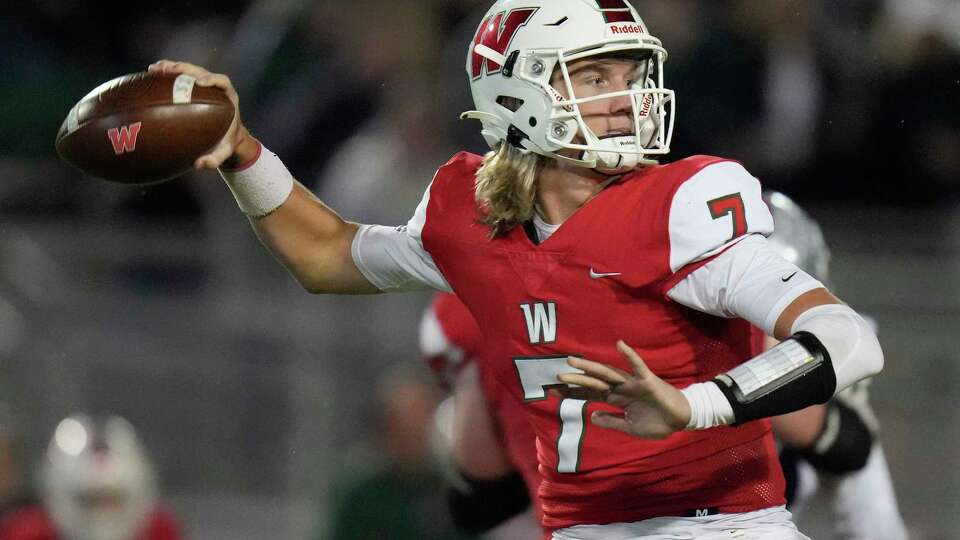 The Woodlands quarterback Mabrey Mettauer throws a pass during the first half of a Region II-6A Division I area high school football playoff game against Klein Cain, Friday, Nov. 18, 2022, in The Woodlands.