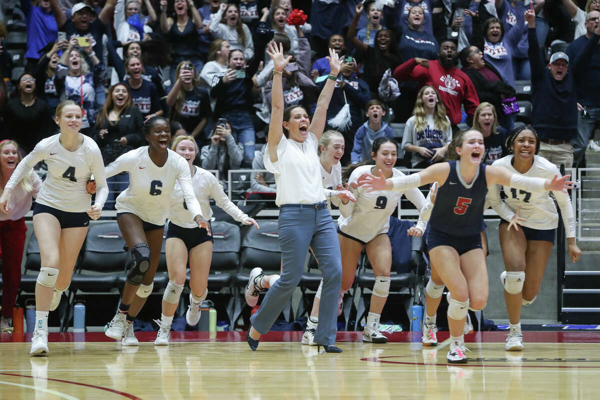 Katy Tompkins players rush the court after defeating Keller in five sets to advance to the Class 6A state final during the UIL State Volleyball Championships at the Curtis Culwell Center, Friday, Nov. 18, 2022, in Garland.