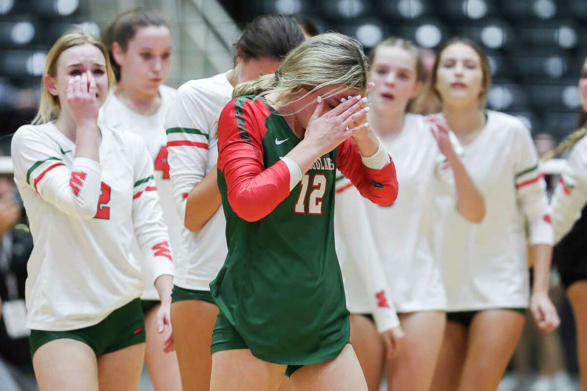 The Woodlands' Molly Tuozzo (12) reacts after losing their Class 6A state semifinal match to Dripping Springs during the UIL State Volleyball Championships at the Curtis Culwell Center, Friday, Nov. 18, 2022, in Garland.