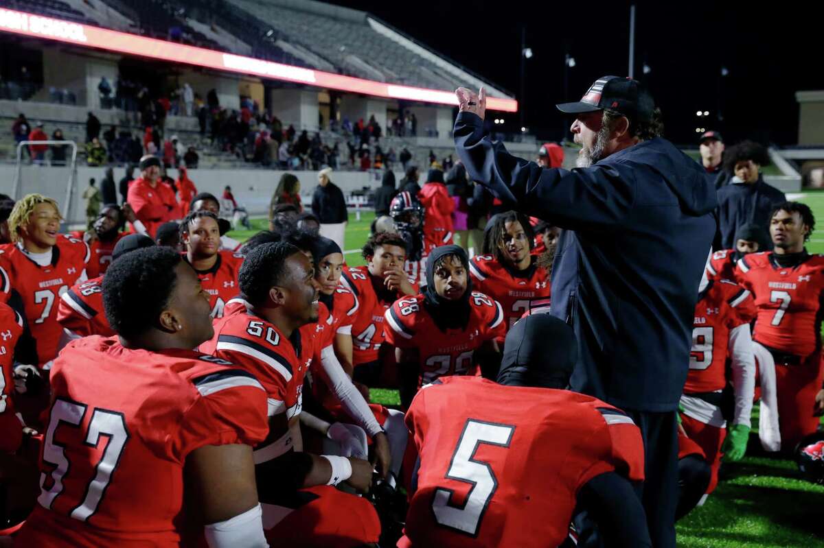 Westfield head coach Matt Meekins, right, addresses the team after their 41-38 win over Klein Collins after their Region II-6A Division 1 area playoff high school football game held at Tomball ISD Stadium Friday, Nov. 18, 2022 in Tomball, TX.