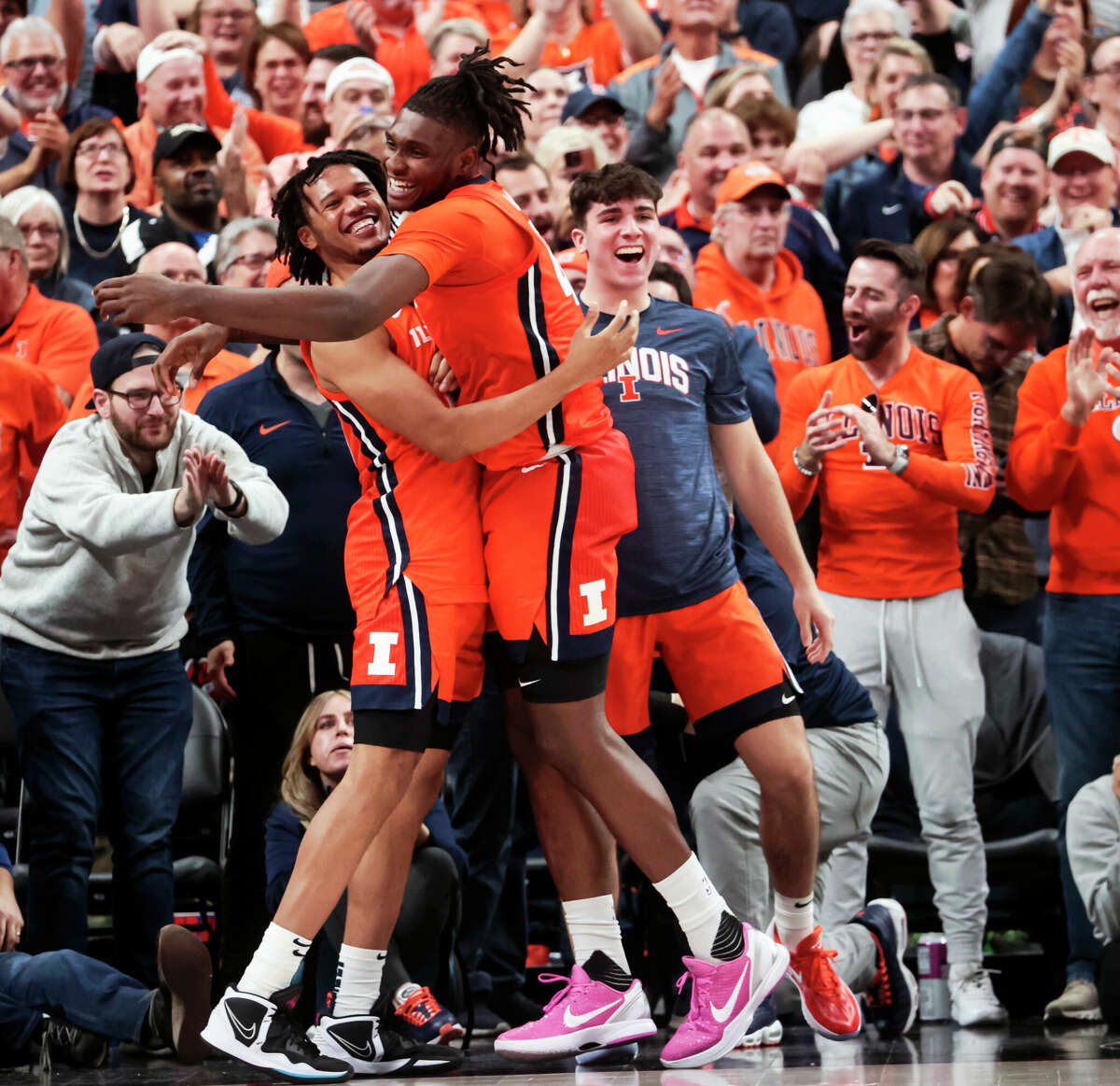 Illinois forwards Ty Rodgers, left, and Dain Dainja (42) celebrate Friday night's win over UCLA in the Continental Tire Main Event tournament in Las Vegas.
