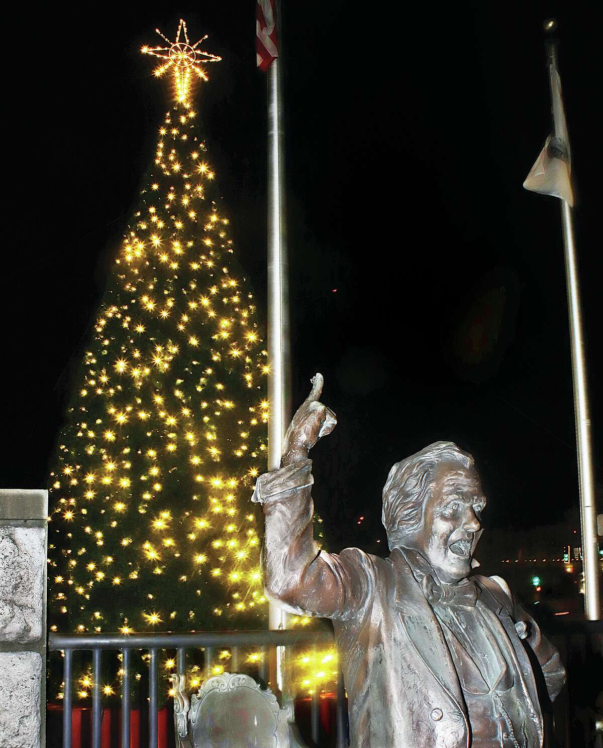 John Badman|The Telegraph The statue of Stephen A. Douglas seemed to proclaim the new Christmas tree lit Friday night in Alton.