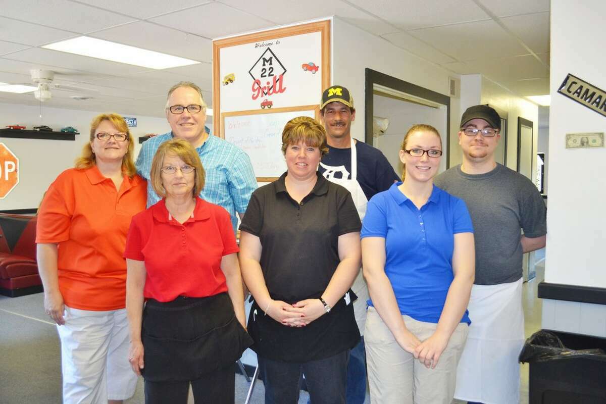 This file photo shows M-22 Grill staff after opening in June 2013. Staff members pictured are (back row from left) Michelle Blackman, John Blackman, Steve Orlowski, Josh Pifer; (front row from left) the late Gloria Ex, Tanya Lindeman and Amelia Koniecik.