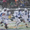 Gladwin's football team takes the field for Saturday's Division 5 state semifinal against Grand Rapids Catholic Central at Ithaca High School, Nov. 19, 2022.