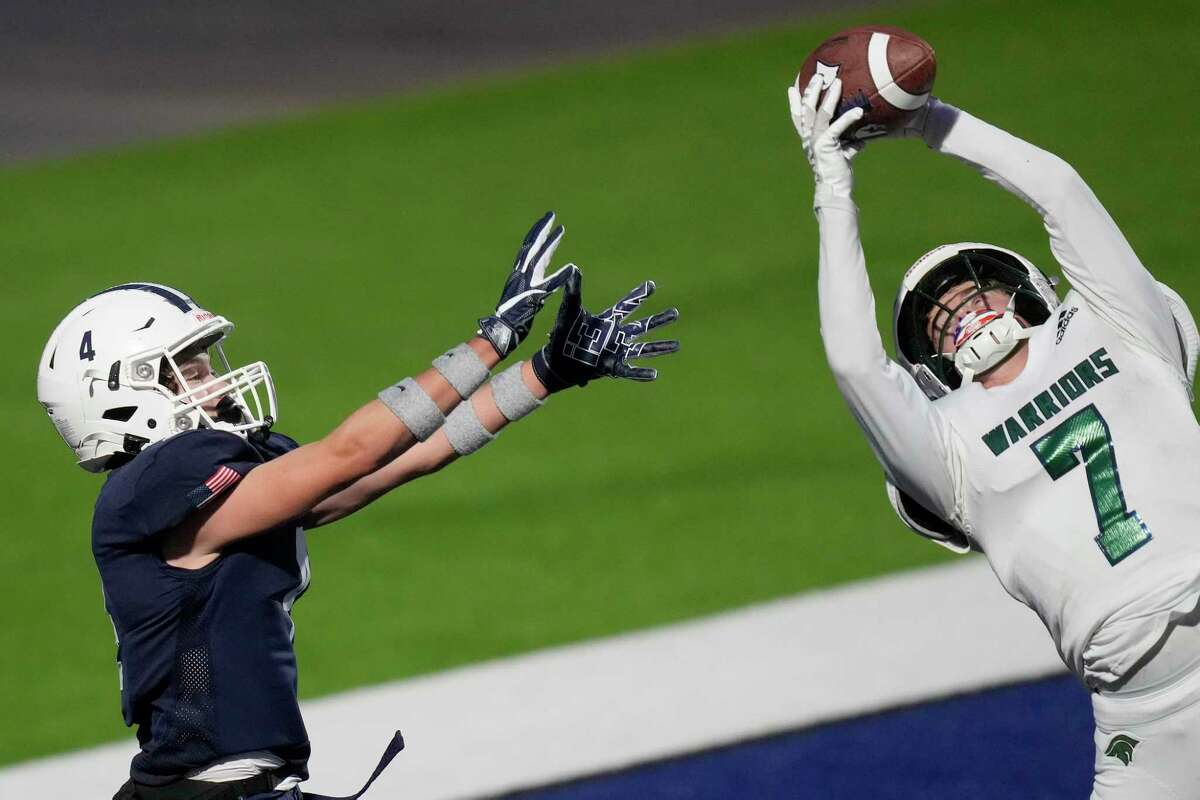The Woodlands Christian Academy defensive back Josh Johnson (7) intercepts a pass intended for Second Baptist wide receiver Jackson Powers during the second half of a TAPPS Division II area high school football playoff game, Saturday, Nov. 19, 2022, in Houston.