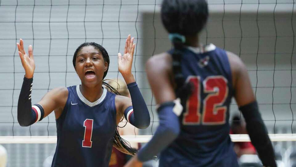 Katy Tompkins' Christin Cowart (1) reacts after scoring a point in the first set of the Class 6A state championship match during the UIL State Volleyball Championships at the Curtis Culwell Center, Saturday, Nov. 19, 2022, in Garland.