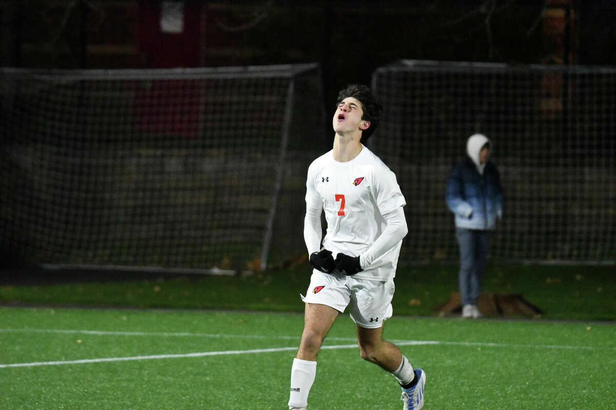 Greenwich's Maximo Ferrario celebrates after scoring a penalty kick during the Class LL boys soccer finals between Hall and Greenwich at Trinity Health Stadium on Saturday, Nov. 19, 2022.
