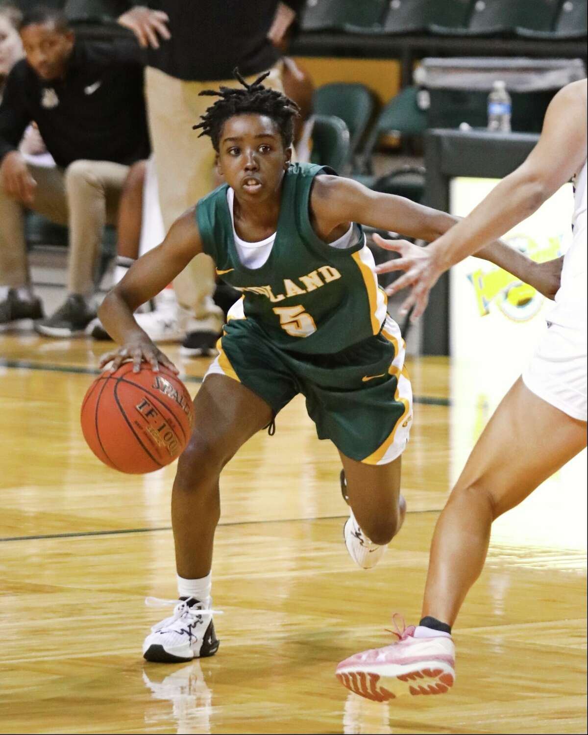 Midland College's Janay Quinn dribbles the ball against Collin County Community College during a Nov. 19 game at the Midland Women's National Invitation Tournament at Chaparral Center. 