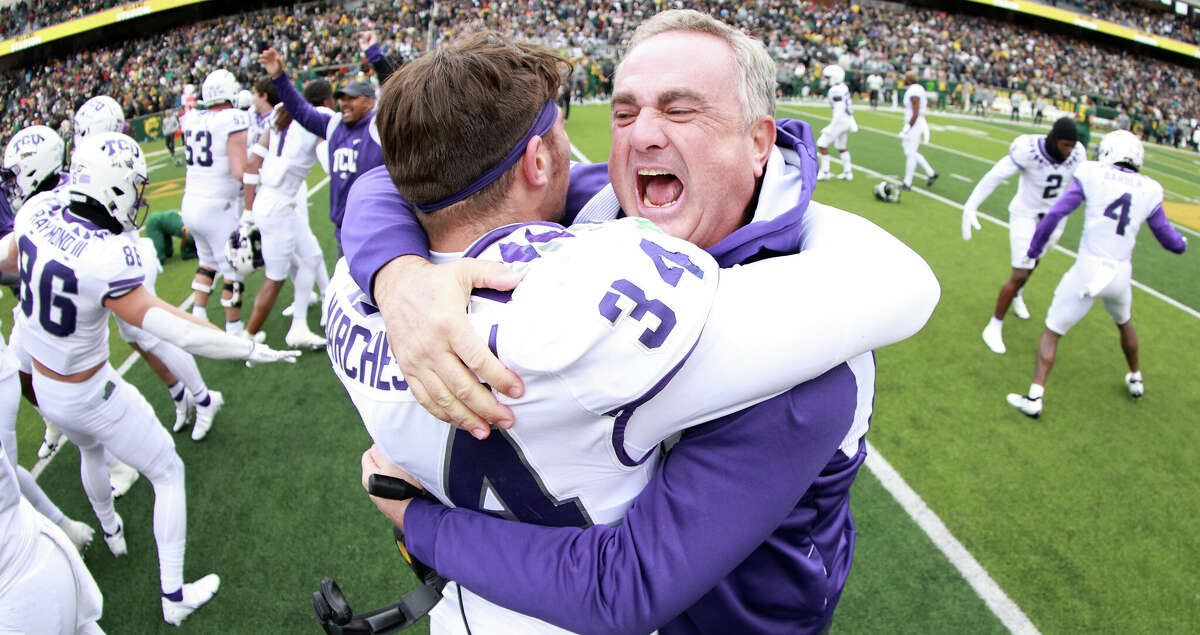 Head coach Sonny Dykes of the TCU Horned Frogs celebrates with linebacker Zach Marcheselli #34 of the TCU Horned Frogs after the Horned Frogs beat the Baylor Bears 29-28 at McLane Stadium on November 19, 2022 in Waco, Texas. (Photo by Tom Pennington/Getty Images)