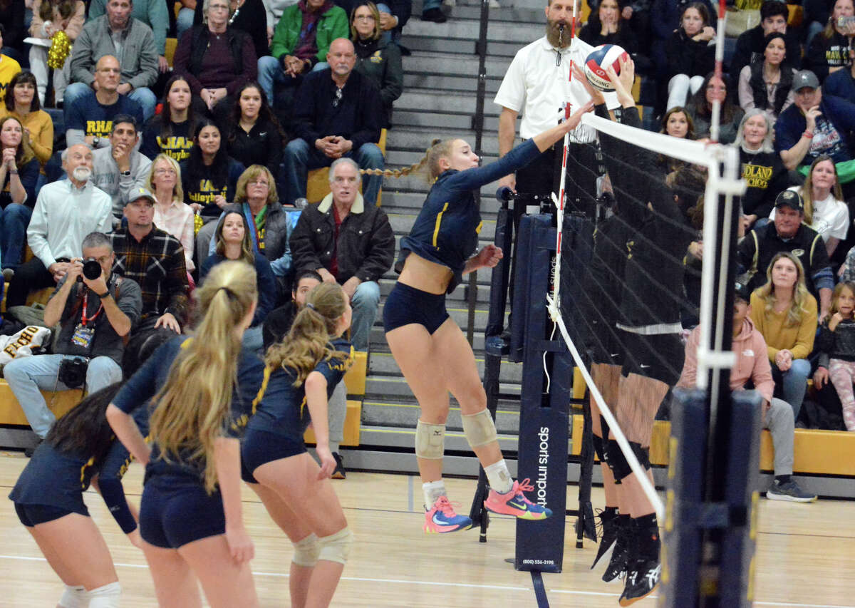 Leilani Fecho of RHAM blasts a shot to help lead the Raptors to a 3-0 win over Woodland in the CIAC Class M championship Saturday, Nov. 19, 2022 at East Haven High School.