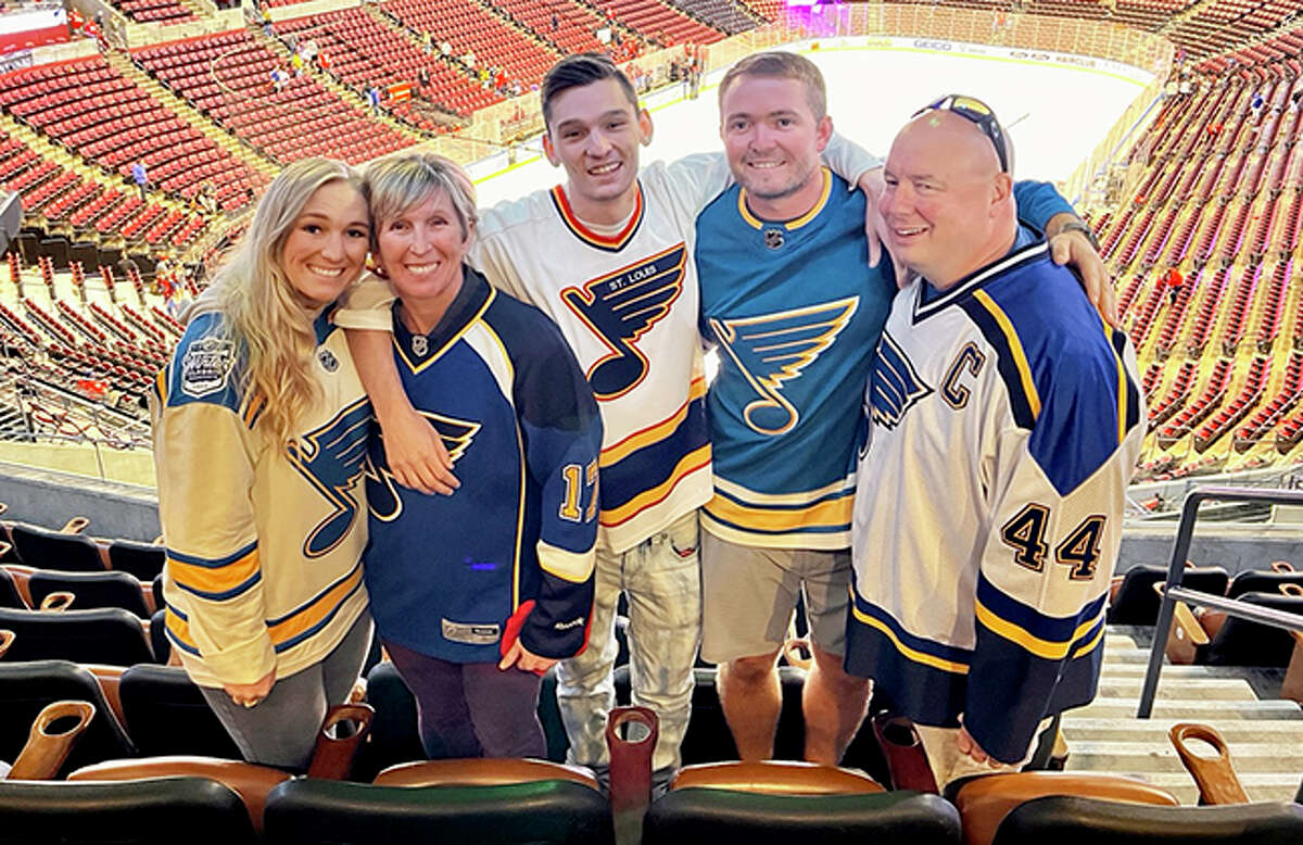Edwardsville graduate Jenny (Johnson) Norton, second from left, and her family at a St. Louis Blues game in October 2021.