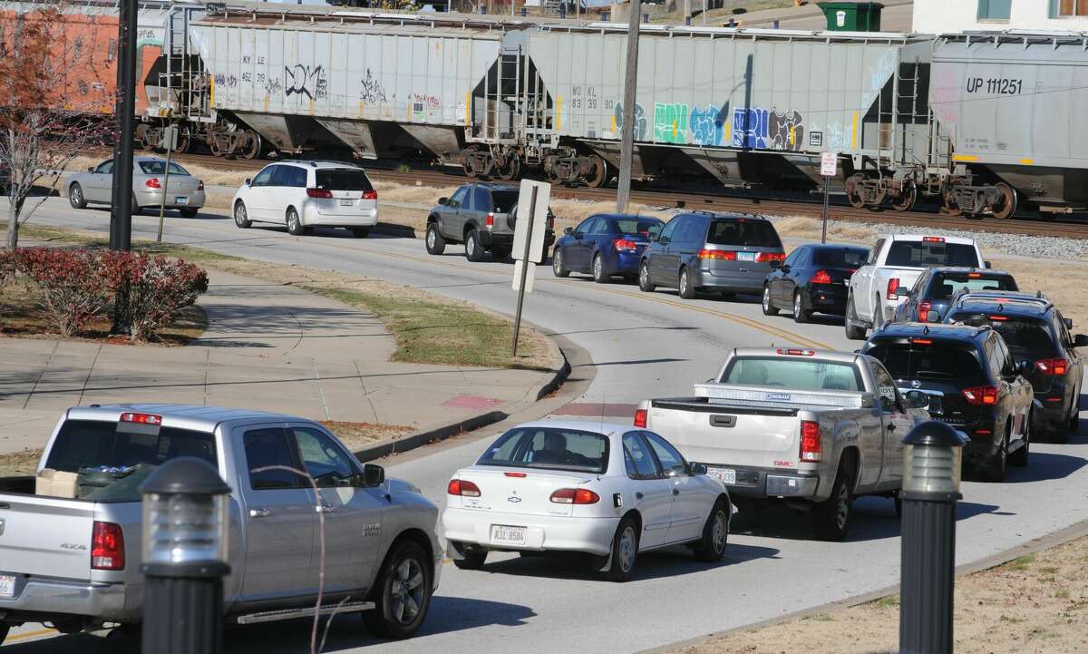 A steady line of cars wrapped completely around the amphitheater access road during Saturday's turkey giveaway in the Liberty Bank Alton Amphitheater. Since 2014, TorHoerman Law has given away more than 5,000 Thanksgiving turkeys to area residents.