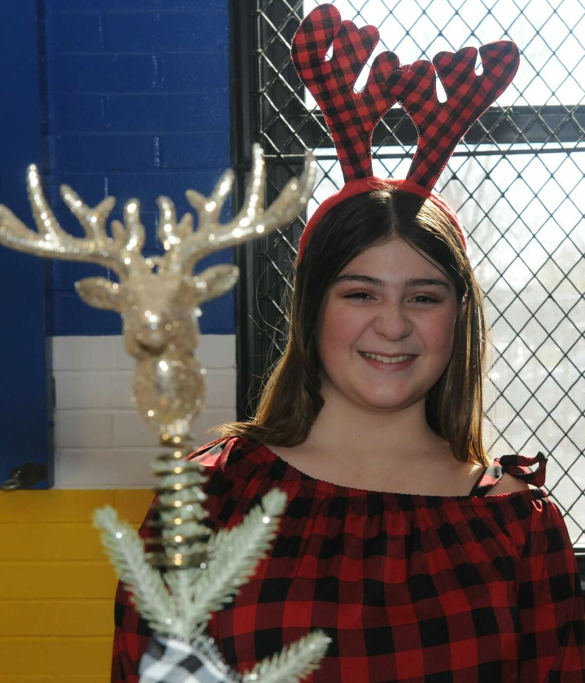 Jenna Lambiase wore and sold reindeer paraphernalia during Saturday's Christmas Bazaar.   