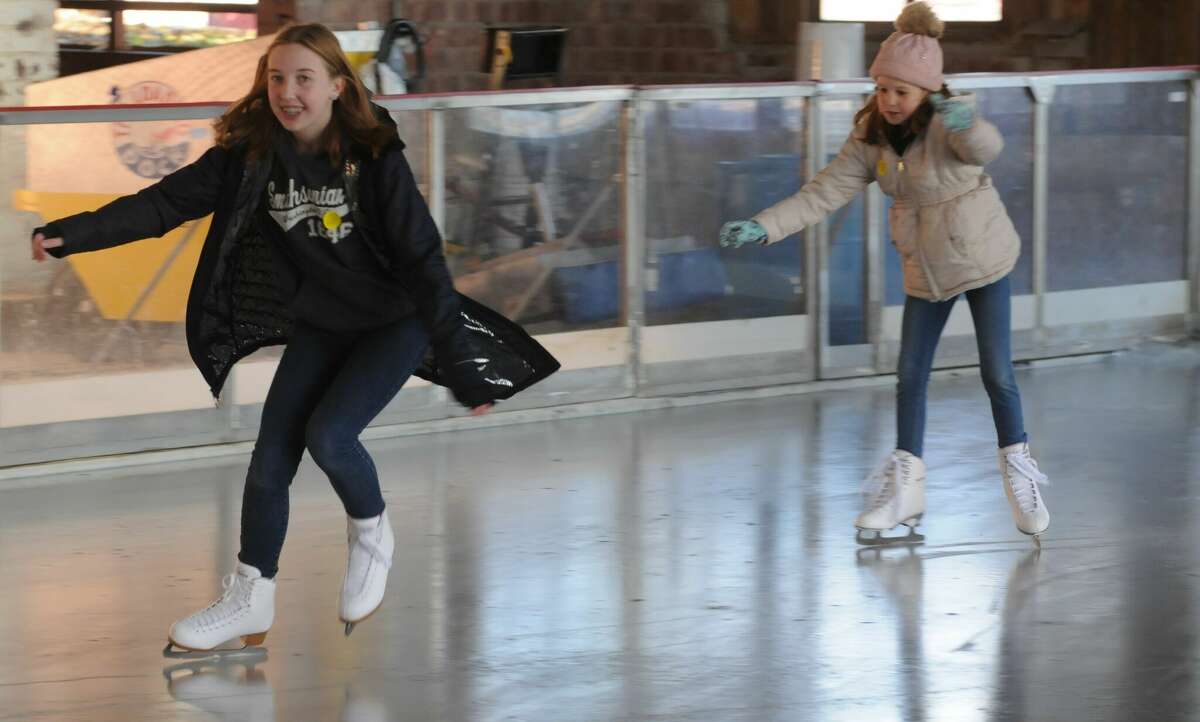 McKenna and Harper Adam of Godfrey enjoy the opening day of ice skating at The Loading Dock in Grafton.