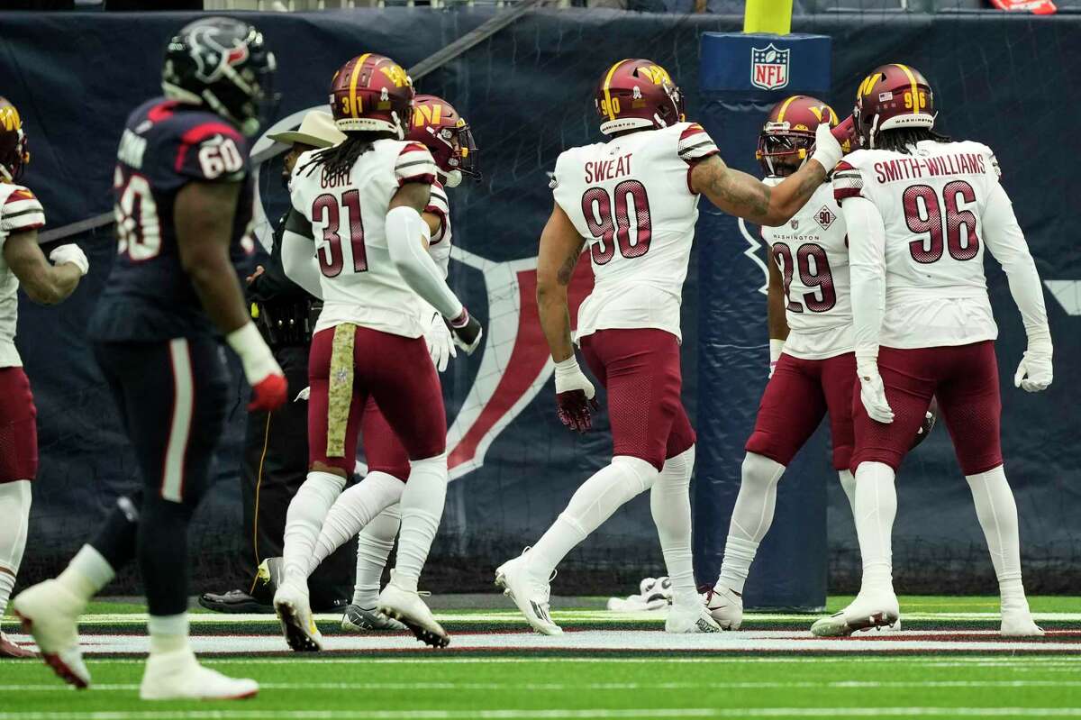 Washington Commanders cornerback Kendall Fuller (29) celebrates his interception for a touchdown against the Houston Texans during the first half of an NFL football game Sunday, Nov. 20, 2022, in Houston.