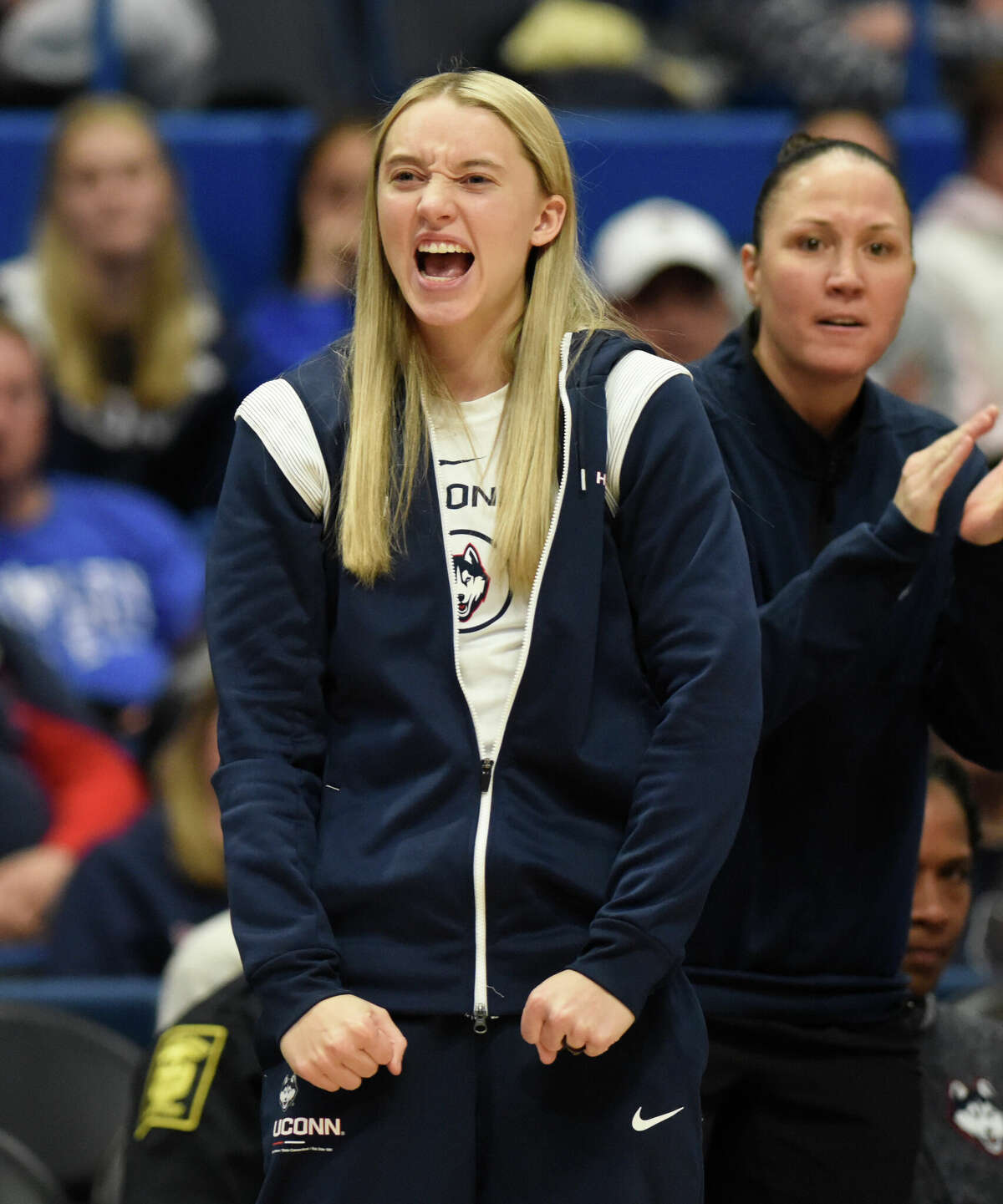 UConn guard Paige Bueckers cheers her team on from the sidelines during No. 5 UConn's 91-69 win over No. 10 NC State in the NCAA women's college basketball game at the XL Center in Hartford, Conn. Sunday, Nov. 20, 2022.