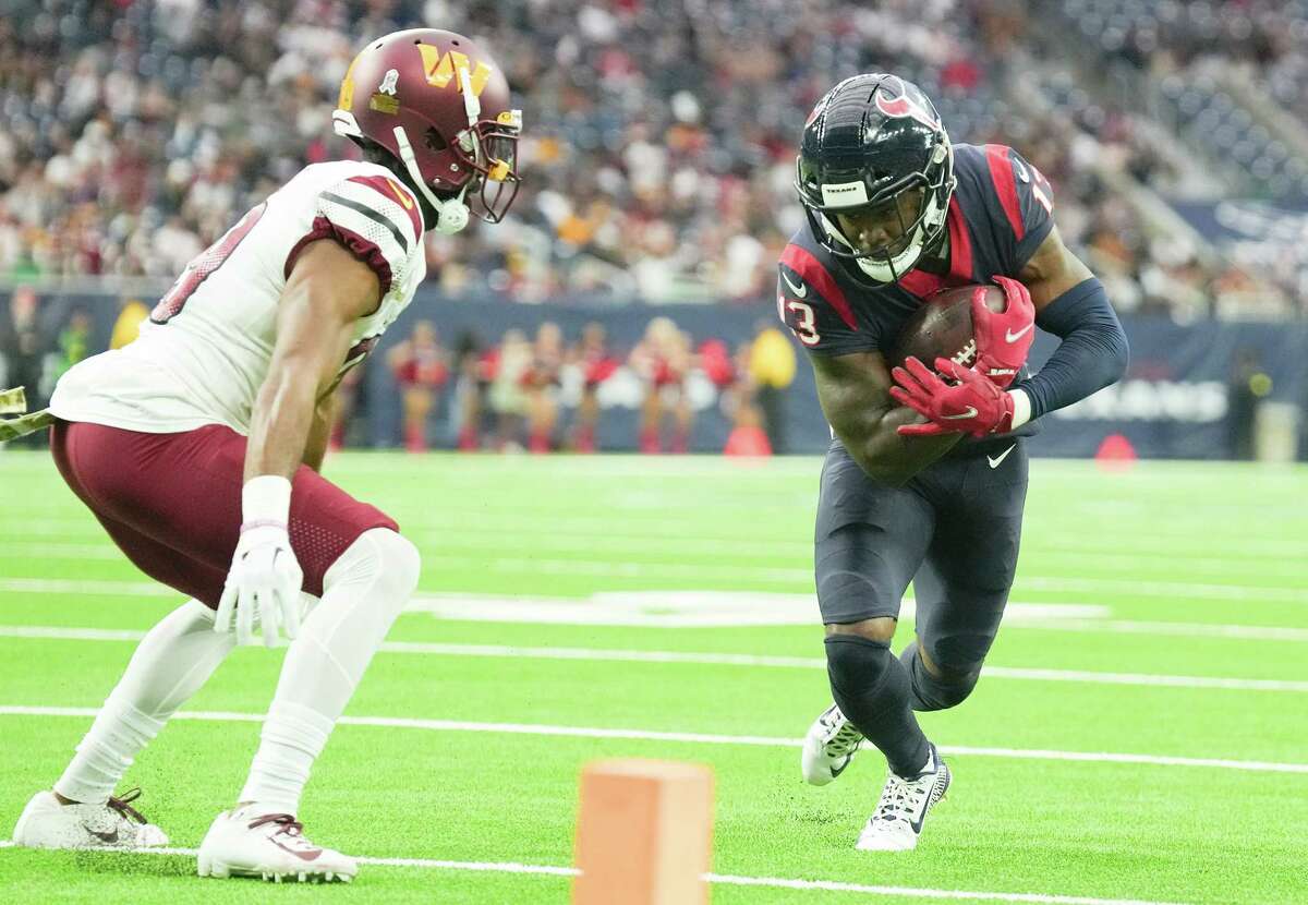 Houston Texans wide receiver Brandin Cooks (13) works his way for extra yards, short of the goal line in the second half at NRG Stadium on Sunday, Nov. 20, 2022 in Houston. Washington Commanders won the game 23-10.