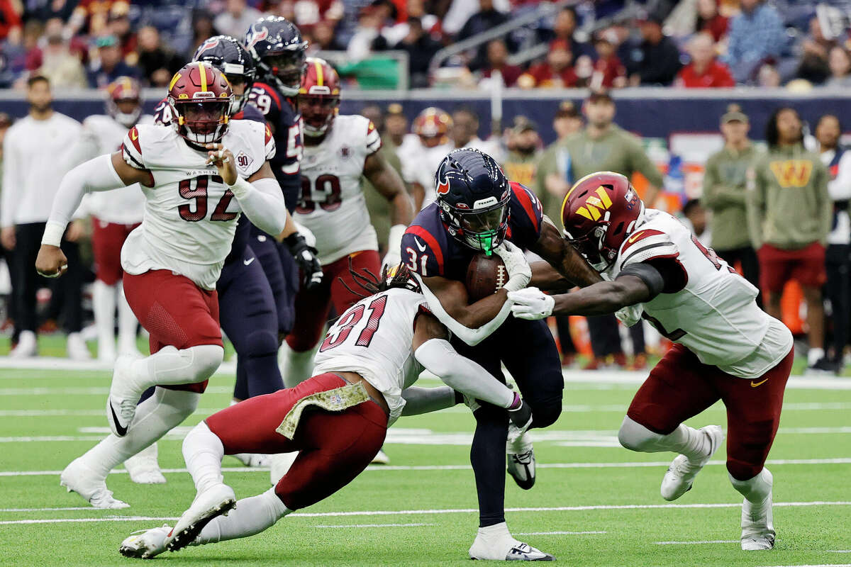 Dameon Pierce #31 of the Houston Texans runs with the ball after a reception in the third quarter of a game against the Washington Commanders at NRG Stadium on November 20, 2022 in Houston.
