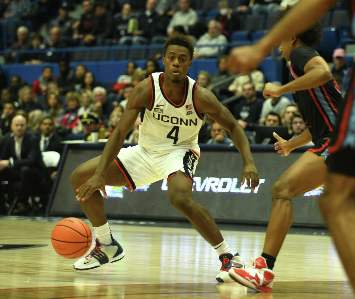 UConn guard Nahiem Alleyne (4) controls the ball in the NCAA men's college basketball game between No. 25 UConn and Delaware State at the XL Center in Hartford, Conn. Sunday, Nov. 20, 2022.