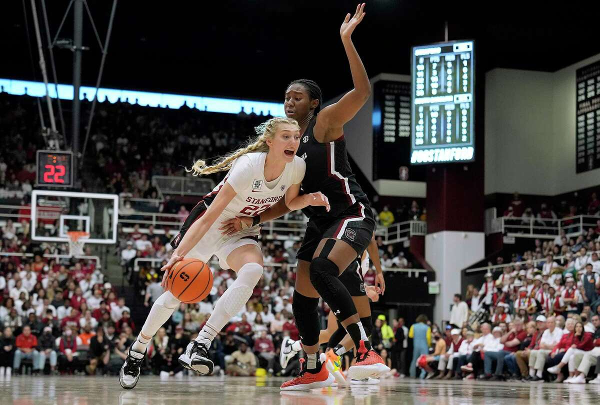 PALO ALTO, CALIFORNIA - NOVEMBER 20: Cameron Brink #22 of the Stanford Cardinal drives to the basket on Aliyah Boston #4 of the South Carolina Gamecocks during the fourth quarter at Stanford Maples Pavilion on November 20, 2022 in Palo Alto, California. (Photo by Thearon W. Henderson/Getty Images)