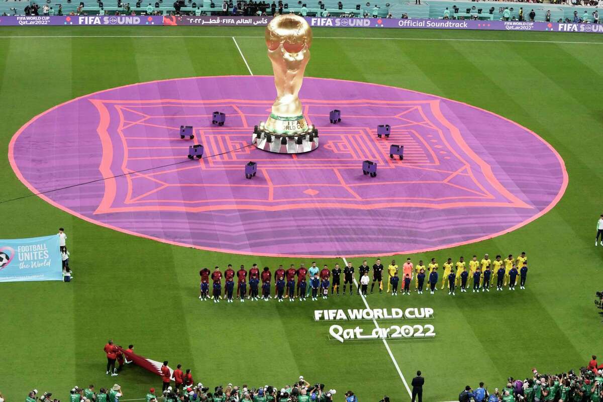 Teams line up before the World Cup group match between Qatar and Ecuador at the Al Bayt Stadium in Al Khor, Qatar, Sunday, Nov. 20, 2022. (AP Photo/Hassan Ammar)